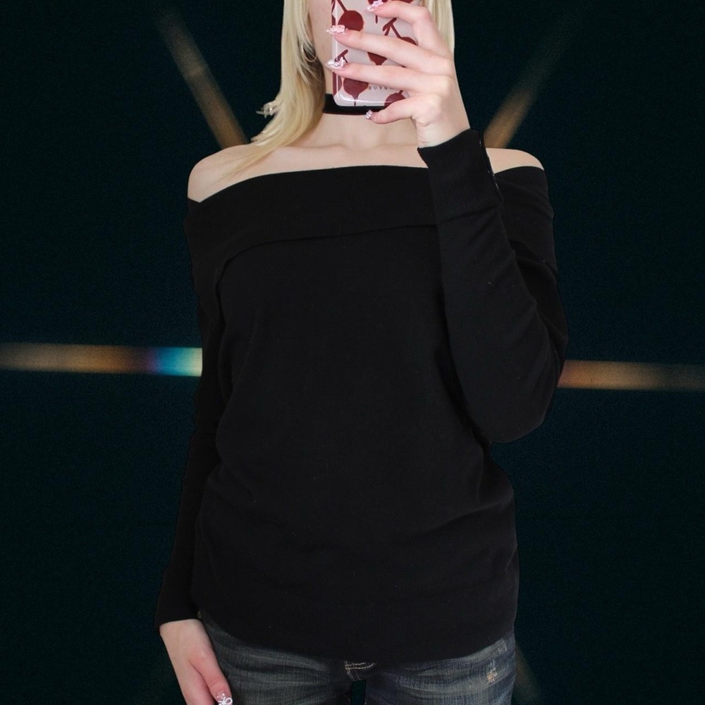 Black off the shoulder knit sweater with button detailing on the sleeves